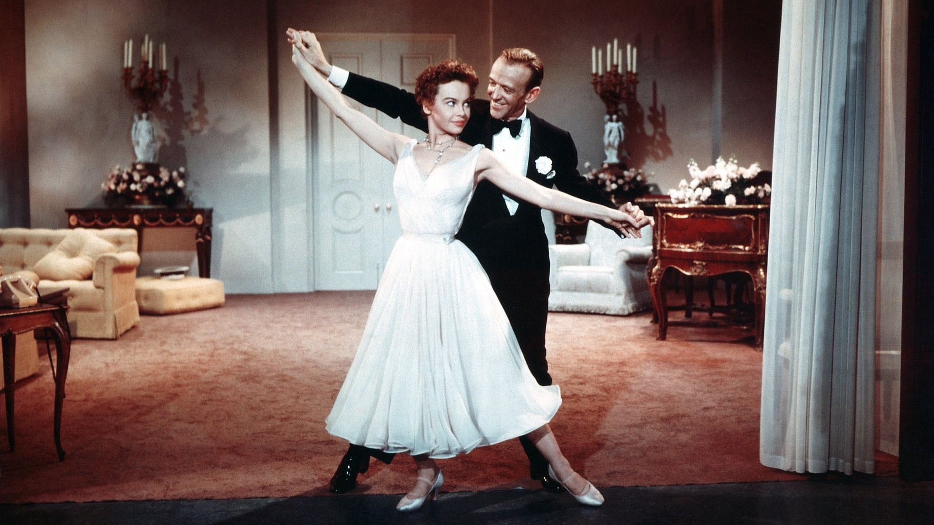 Cinematic background from Daddy Long Legs 1955 - Wealthy American, Jervis Pendleton has a chance encounter at a French orphanage with a cheerful 18-year-old resident, and anonymously pays for her education at a New England college. She writes letters to her mysterious benefactor regularly, but he never writes back. Several years later, he visits her at school, while still concealing his identity, and—despite their large age difference—they soon fall in love.