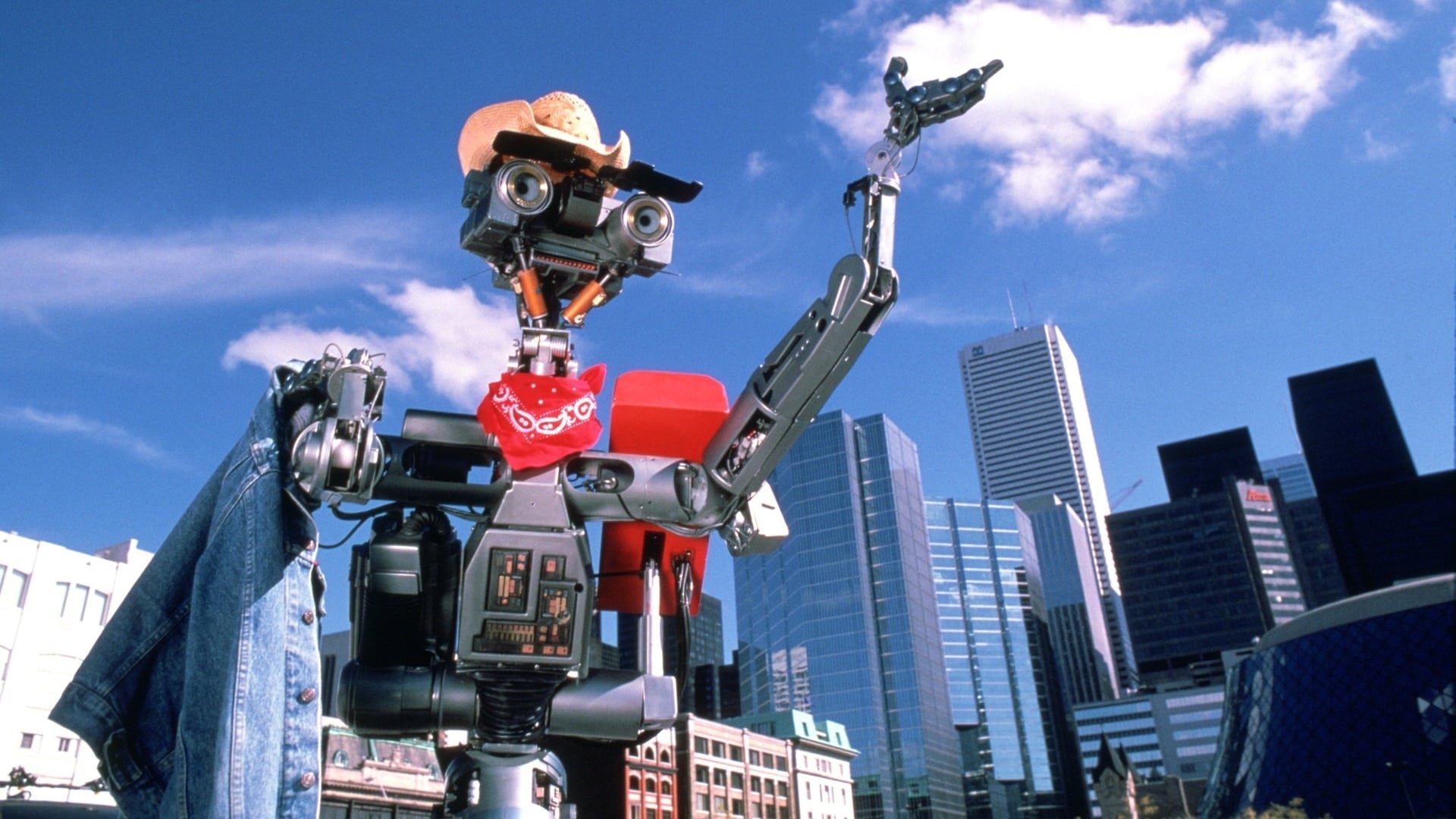 Cinematic background from Short Circuit 2 1988 - Robot Johnny 5 moves to the city to help his friend Ben Jahrvi with his toy manufacturing enterprise, only to be manipulated by criminals who want to use him for their own nefarious purposes.