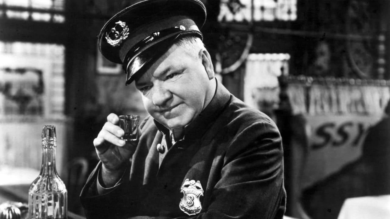 Cinematic background from The Bank Dick 1940 - Egbert Sousé becomes an unexpected hero when a bank robber falls over a bench he's occupying. Now considered brave, Egbert is given a job as a bank guard. Soon, he is approached by charlatan J. Frothingham Waterbury about buying shares in a mining company. Egbert persuades teller Og Oggilby to lend him bank money, to be returned when the scheme pays off. Unfortunately, bank inspector Snoopington then makes a surprise appearance.