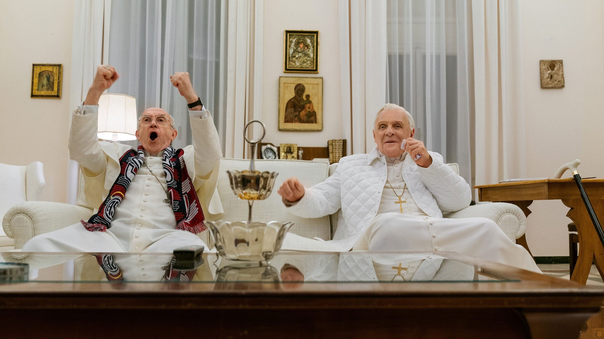 Cinematic background from The Two Popes 2019 - Frustrated with the direction of the church, Cardinal Bergoglio requests permission to retire in 2012 from Pope Benedict. Instead, facing scandal and self-doubt, the introspective Pope Benedict summons his harshest critic and future successor to Rome to reveal a secret that would shake the foundations of the Catholic Church.