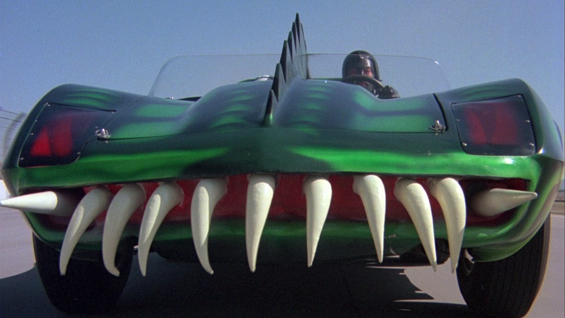 Cinematic background from Death Race 2000 1975 - In a boorish future, the government sponsors a popular, but bloody, cross-country race in which points are scored by mowing down pedestrians. Five teams, each comprised of a male and female, compete using cars equipped with deadly weapons. Frankenstein, the mysterious returning champion, has become America's hero, but this time he has a passenger from the underground resistance.