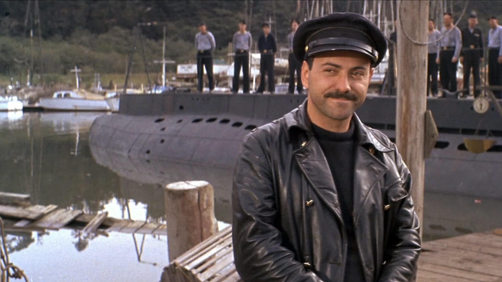 Cinematic background from The Russians Are Coming the Russians Are Coming 1966 - When a Soviet submarine gets stuck on a sandbar off the coast of a New England island, its commander orders his second-in-command, Lieutenant Rozanov, to get them moving again before there is an international incident. Rozanov seeks assistance from the island locals, including the police chief and a vacationing television writer, while trying to allay their fears of a Communist invasion by claiming he and his crew are Norwegian sailors.