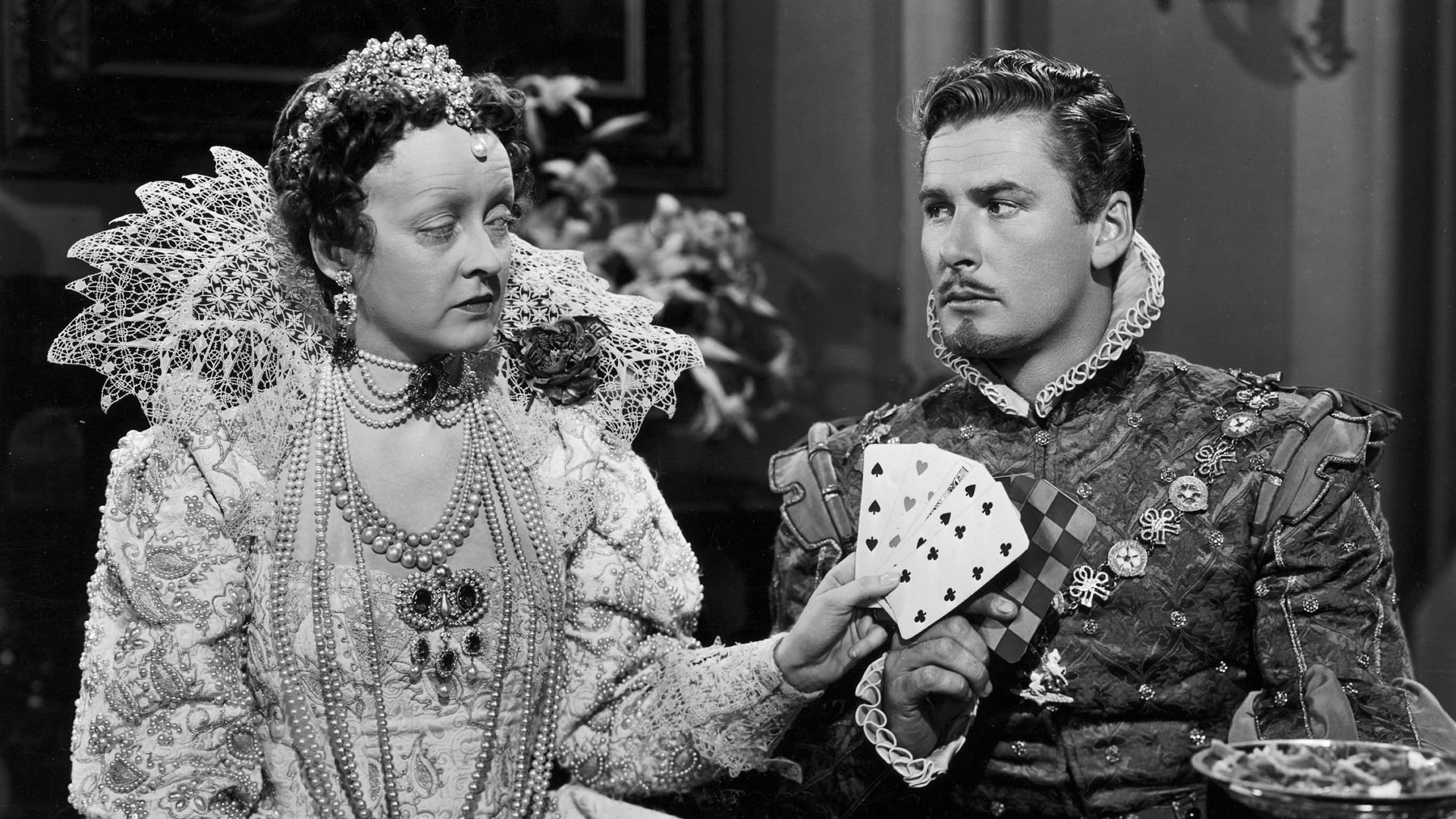 Cinematic background from The Private Lives of Elizabeth and Essex 1939 - This period drama frames the tumultuous affair between Queen Elizabeth I and the man who would be King of England.