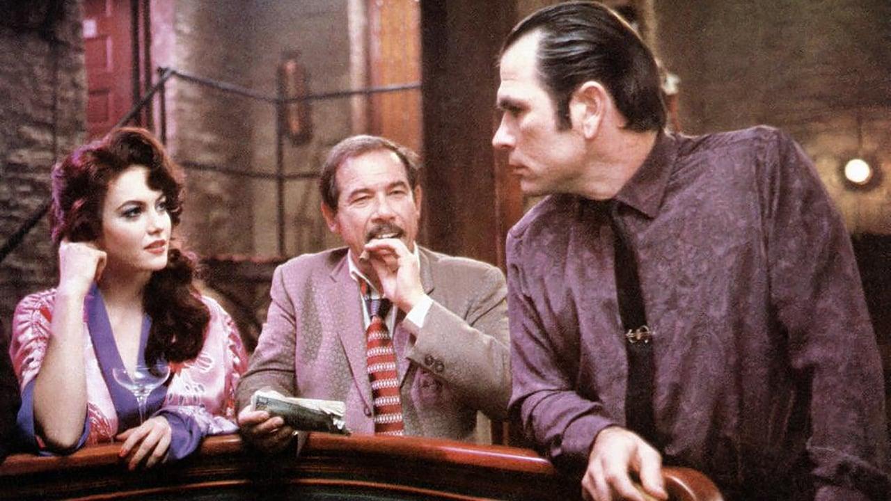 Cinematic background from The Big Town 1987 - It is 1957. J.C. Cullen is a young man from a small town, with a talent for winning at craps, who leaves for the big city to work as a professional gambler. While there, he breaks the bank at a private craps game at the Gem Club, owned by George Cole, and falls in love with two women, one of them Cole's wife.