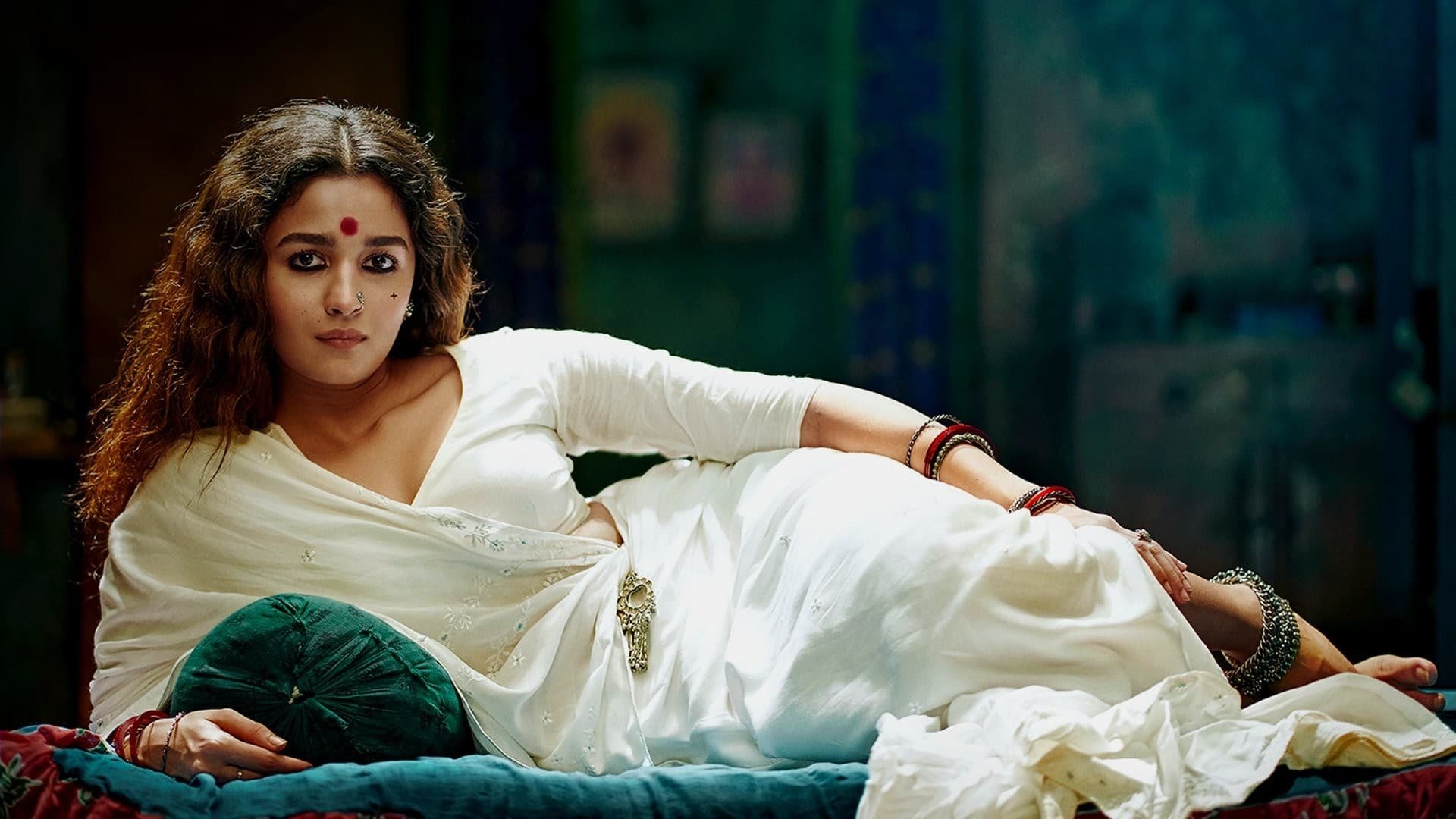 Cinematic background from Gangubai Kathiawadi 2022 - Duped and sold to a brothel, a young woman fearlessly reclaims her power, using underworld connections to preside over the world she was once a pawn in.