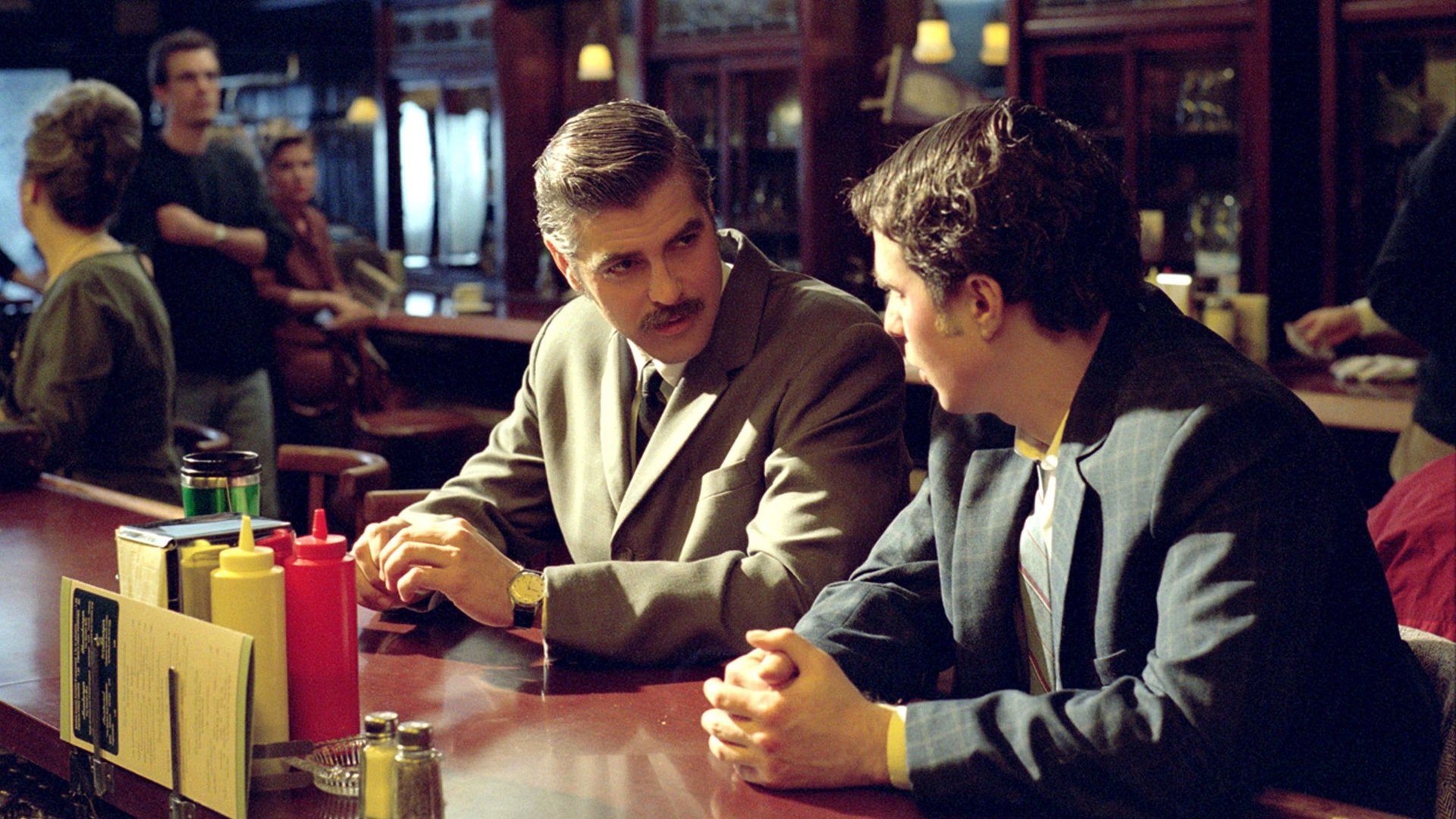 Cinematic background from Confessions of a Dangerous Mind 2002 - Television made him famous, but his biggest hits happened off screen. Television producer by day, CIA assassin by night, Chuck Barris was recruited by the CIA at the height of his TV career and trained to become a covert operative. Or so Barris said.