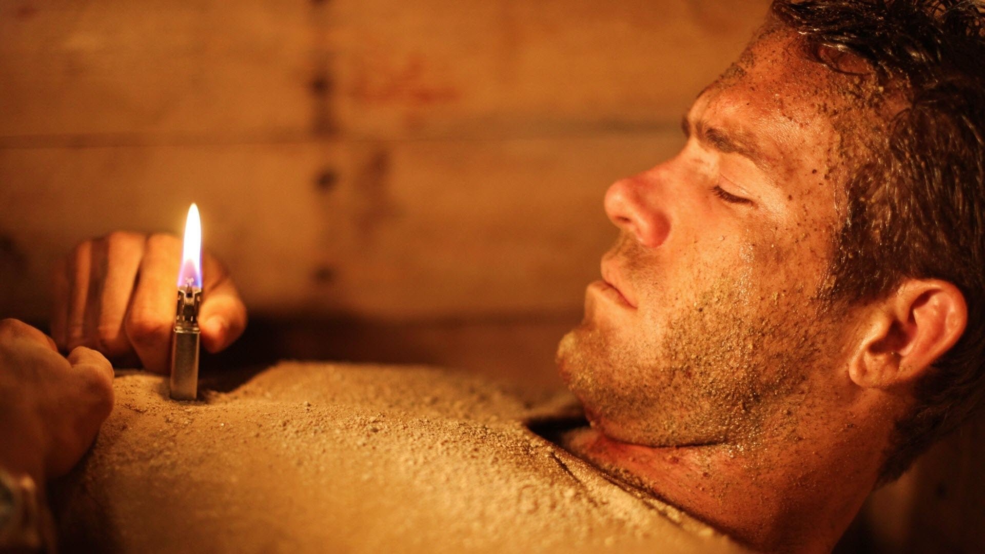 Cinematic background from Buried 2010 - Paul is a U.S. truck driver working in Iraq. After an attack by a group of Iraqis he wakes to find he is buried alive inside a coffin. With only a lighter and a cell phone it's a race against time to escape this claustrophobic death trap.