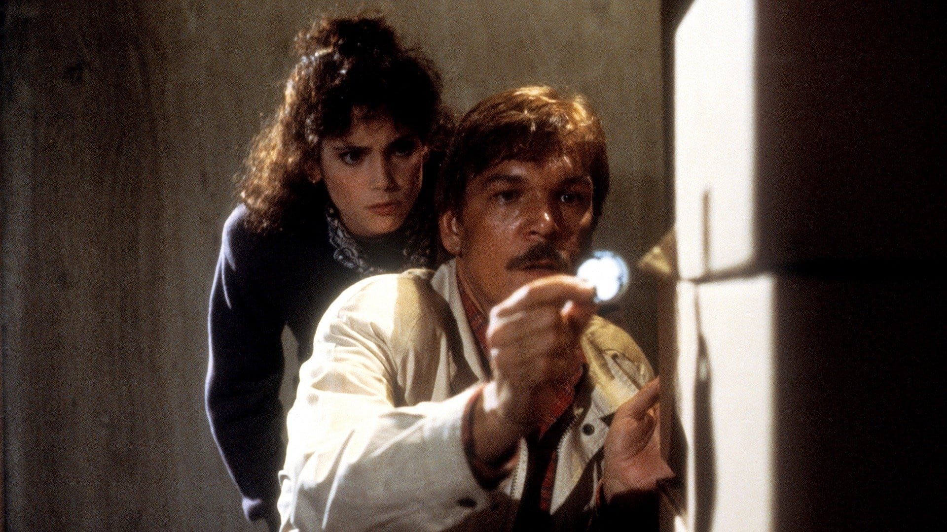 Cinematic background from Halloween III: Season of the Witch 1982 - Dr. Dan Challis and murder victim daughter Ellie Grimbridge uncover a terrible plot by small-town mask maker Conal Cochran, a madman planning a Halloween mass murder utilizing an ancient Celtic ritual. The ritual involves a boulder stolen from Stonehenge, the use of Silver Shamrock masks, and a triggering device contained in a television commercial — all designed to kill millions of children.