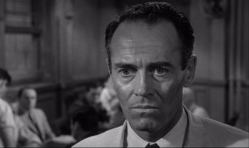 Movie still from “12 Angry Men” (1957), directed by Sidney Lumet – A man in a white dress shirt and a tie; Close Up shot, Over the shoulder angle