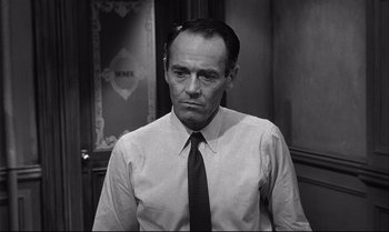 Movie still from “12 Angry Men” (1957), directed by Sidney Lumet – A man in a white dress shirt and a black tie; Close Up shot, Over the shoulder angle