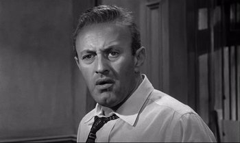 Movie still from “12 Angry Men” (1957), directed by Sidney Lumet – A man in a white dress shirt and a black tie; Close Up shot, Low angle