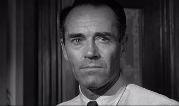 Movie still from “12 Angry Men” (1957), directed by Sidney Lumet – Black and white photograph of a man in a shirt and tie; Close Up shot, Low angle