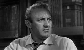 Movie still from “12 Angry Men” (1957), directed by Sidney Lumet – An older man wearing a shirt and a tie; Close Up shot, Low angle