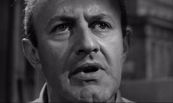 Movie still from “12 Angry Men” (1957), directed by Sidney Lumet – A man with a beard is looking at the camera; Close Up shot, Low angle