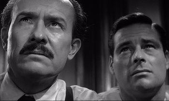 Movie still from “12 Angry Men” (1957), directed by Sidney Lumet – A man with a mustache and a man with a goatee; Close Up shot, Low angle