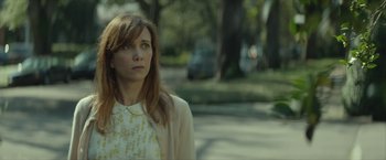 Movie still from “Hateship Loveship” (2013), directed by Liza Johnson – A woman standing on the side of a road; Close Up shot, Over the shoulder angle