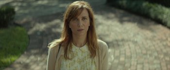 Movie still from “Hateship Loveship” (2013), directed by Liza Johnson – A person with long hair; Close Up shot, Over the shoulder angle