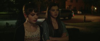 Movie still from “Hateship Loveship” (2013), directed by Liza Johnson – Two young women standing next to each other in a room; Close Up shot, Over the shoulder angle