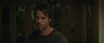 Movie still from “Hateship Loveship” (2013), directed by Liza Johnson – A person with long brown hair; Close Up shot, Over the shoulder angle