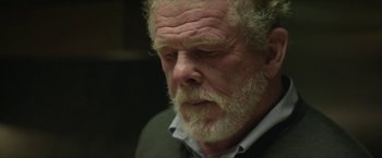 Movie still from “Hateship Loveship” (2013), directed by Liza Johnson – An older man with a beard and a white mustache; Close Up shot, Over the shoulder angle