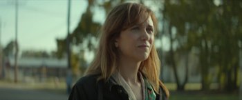 Movie still from “Hateship Loveship” (2013), directed by Liza Johnson – A person with long hair; Close Up shot, Over the shoulder angle