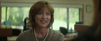 Movie still from “Hateship Loveship” (2013), directed by Liza Johnson – A person wearing a necklace; Close Up shot, Over the shoulder angle