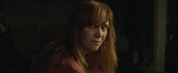Movie still from “Hateship Loveship” (2013), directed by Liza Johnson – A person with long red hair; Close Up shot, Over the shoulder angle
