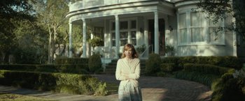 Movie still from “Hateship Loveship” (2013), directed by Liza Johnson – A woman standing in front of a white house; Wide shot, Low angle