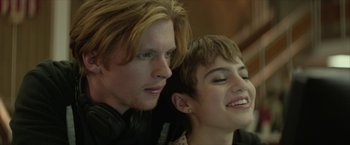 Movie still from “Hateship Loveship” (2013), directed by Liza Johnson – A man and a woman sitting next to each other; Close Up shot, Low angle