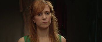 Movie still from “Hateship Loveship” (2013), directed by Liza Johnson – A person with long red hair; Close Up shot, Over the shoulder angle