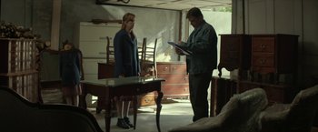 Movie still from “Hateship Loveship” (2013), directed by Liza Johnson – A man and a woman looking at a piece of paper; Medium shot, Over the shoulder angle