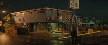 Movie still from “Hateship Loveship” (2013), directed by Liza Johnson – An old motel is being torn down on the side of the road; Extreme Wide shot, Low angle