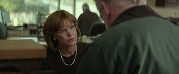 Movie still from “Hateship Loveship” (2013), directed by Liza Johnson – An older woman wearing glasses talking to an older man; Close Up shot, Over the shoulder angle