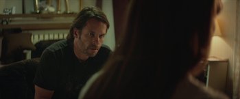 Movie still from “Hateship Loveship” (2013), directed by Liza Johnson – A man looking at himself in the mirror; Close Up shot, Over the shoulder angle