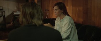 Movie still from “Hateship Loveship” (2013), directed by Liza Johnson – A woman sitting in front of another woman in a room; Medium shot, Over the shoulder angle