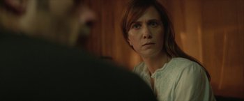 Movie still from “Hateship Loveship” (2013), directed by Liza Johnson – A woman looking at a man in front of a wall; Close Up shot, Over the shoulder angle