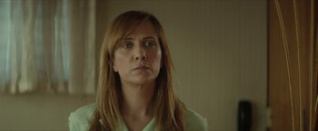 Movie still from “Hateship Loveship” (2013), directed by Liza Johnson – A person with long red hair; Close Up shot, Over the shoulder angle