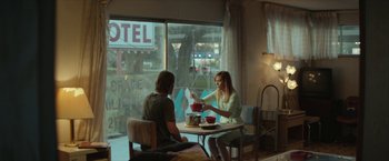 Movie still from “Hateship Loveship” (2013), directed by Liza Johnson – A man and a woman sitting in front of a window; Wide shot, Over the shoulder angle