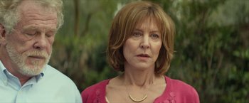 Movie still from “Hateship Loveship” (2013), directed by Liza Johnson – A person wearing a pink shirt; Close Up shot, Over the shoulder angle