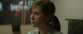 Movie still from “Hateship Loveship” (2013), directed by Liza Johnson – A person with long hair; Close Up shot, Over the shoulder angle