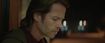 Movie still from “Hateship Loveship” (2013), directed by Liza Johnson – A person with long brown hair; Close Up shot, Over the shoulder angle