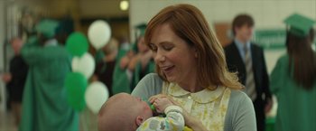 Movie still from “Hateship Loveship” (2013), directed by Liza Johnson – A woman holding a baby in her arms and feeding it; Close Up shot, Over the shoulder angle