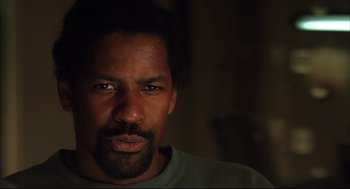 Movie still from “He Got Game” (1998), directed by Spike Lee – A person wearing a green shirt; Close Up shot, Over the shoulder angle