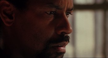 Movie still from “He Got Game” (1998), directed by Spike Lee – A man's eyes and face; Extreme Close Up shot, Low angle
