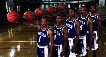 Movie still from “He Got Game” (1998), directed by Spike Lee – A group of basketball players in blue and white uniforms; Wide shot, Low angle