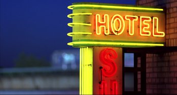 Movie still from “He Got Game” (1998), directed by Spike Lee – A neon sign on the side of a building; Extreme Close Up shot, Low angle
