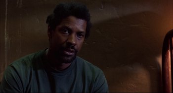 Movie still from “He Got Game” (1998), directed by Spike Lee – A person wearing a green shirt; Close Up shot, Low angle