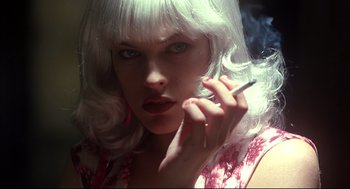 Movie still from “He Got Game” (1998), directed by Spike Lee – A woman with white hair is smoking a cigarette; Close Up shot, Low angle