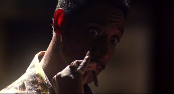 Movie still from “He Got Game” (1998), directed by Spike Lee – A person holding a cigarette in his mouth; Extreme Close Up shot, Low angle