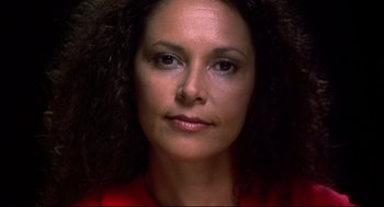 Movie still from “He Got Game” (1998), directed by Spike Lee – A woman's face in a red shirt; Close Up shot, High angle